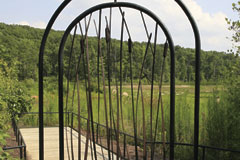 Cattail embellished gate leading to Marsh trail